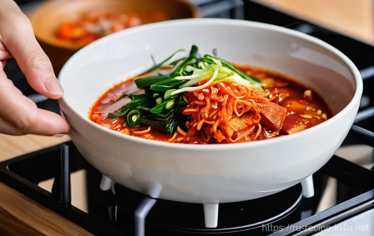 김치찌개 만드는 동영상 추천 - **Prompt 1: Cozy Evening Kimchi Jjigae**
    A close-up shot of a steaming, vibrant red Kimchi Jjiga...